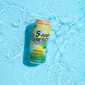 Individual can of 5-hour ENERGY Pineapple Splash in water