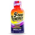 A bottle of 5-hour Energy Regular Strength grape-flavored dietary supplement, featuring a vibrant red-to-yellow-to-purple gradient label with bold black and yellow text.