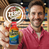 Man holding a 5-hour ENERGY Zero Sugar Berry bottle in a store setting