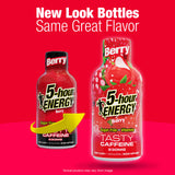 Two 5-hour Energy Berry drink supplement bottles on a bright red background, with text reading 'New Look Bottles Same Great Flavor.' One bottle is shown as the older red bottle and the other as the new illustrated strawberry-themed bottle, with a yellow arrow pointing from the old to the new bottle.