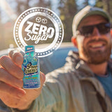 Man holding a 5-hour Energy drink with 'Zero Sugar' label in the foreground