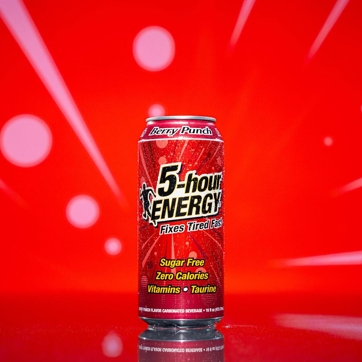 Individual can of Berry Punch in front of red background