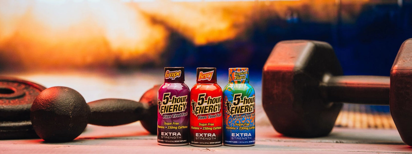 5-hour Energy drinks with gym equipment in the background