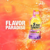 A bottle of 5-hour Energy Hawaiian Breeze flavor caffeine drink is shown floating in a splash of orange and red liquid, with the text 'FLAVOR PARADISE' on the left.