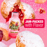 A bottle of Jelly Donut 5-hour Energy Raspberry Jelly Bean Tasty Caffeine drink is shown in front of powdered jelly donuts on a pink background, with text reading 'JAM-PACKAGED with Flavor'.