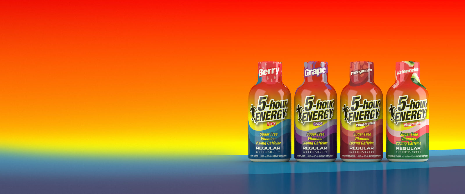 Four bottles of 5-Hour Energy drink arranged in a row on a reflective surface against a vibrant orange-to-yellow gradient background. The bottles represent different flavors: Berry, Grape, Peach, and Mango.